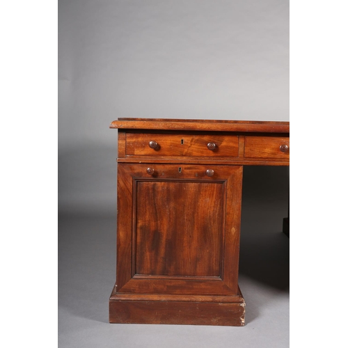 371 - A 19TH CENTURY FIGURED MAHOGANY PARTNER'S DESK, c1830, having a green leather incised writing surfac... 