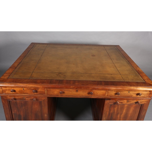 371 - A 19TH CENTURY FIGURED MAHOGANY PARTNER'S DESK, c1830, having a green leather incised writing surfac... 