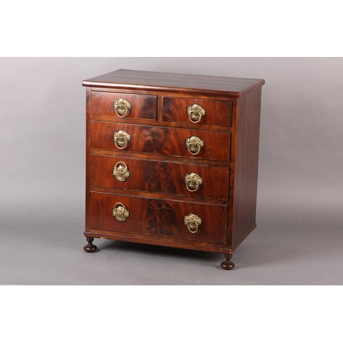 373 - A MID 19TH CENTURY FIGURED MAHOGANY NEST of two short and three long graduated drawers, with gilt me... 