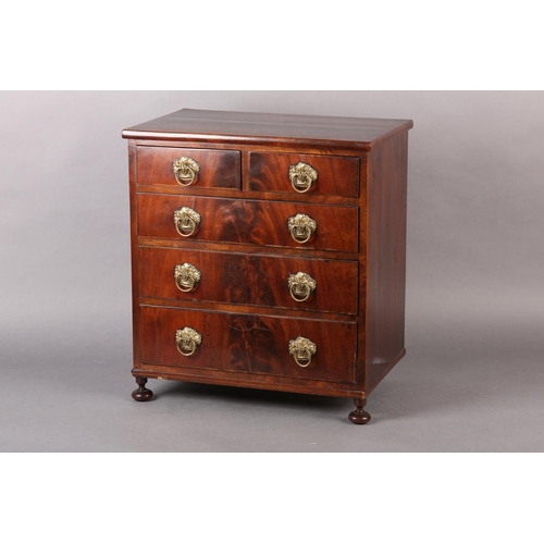 373 - A MID 19TH CENTURY FIGURED MAHOGANY NEST of two short and three long graduated drawers, with gilt me... 