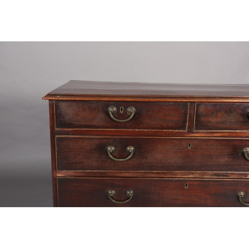 374 - A GEORGE III MAHOGANY CHEST of two short and three long graduated drawers, cockbeaded, gilt metal sw... 