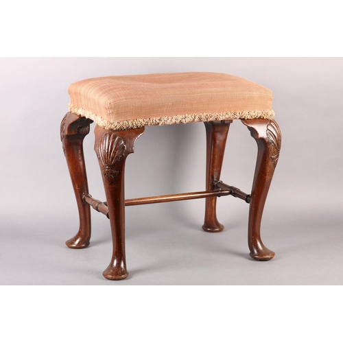 375 - A GEORGE III MAHOGANY STOOL, rectangular, having an upholstered seat, on cabriole legs carved with a... 