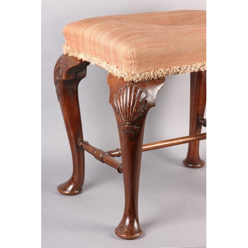 375 - A GEORGE III MAHOGANY STOOL, rectangular, having an upholstered seat, on cabriole legs carved with a... 