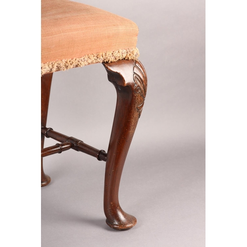 375 - A GEORGE III MAHOGANY STOOL, rectangular, having an upholstered seat, on cabriole legs carved with a... 