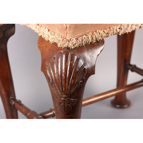 375 - A GEORGE III MAHOGANY STOOL, rectangular, having an upholstered seat, on cabriole legs carved with a... 