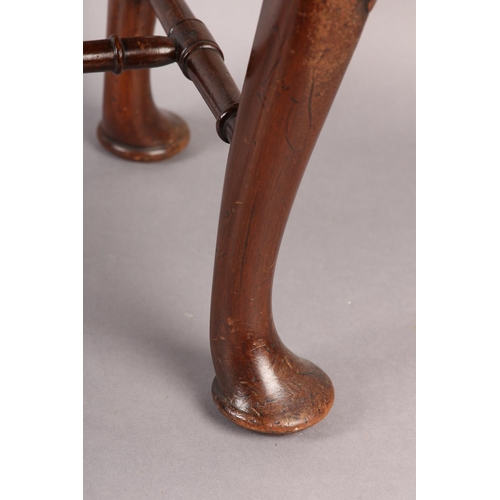 375 - A GEORGE III MAHOGANY STOOL, rectangular, having an upholstered seat, on cabriole legs carved with a... 