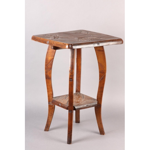 391 - AN AESTHETIC MOVEMENT POLISHED BEECH OCCASIONAL TABLE, in the Liberty style, all-over carved with ir... 