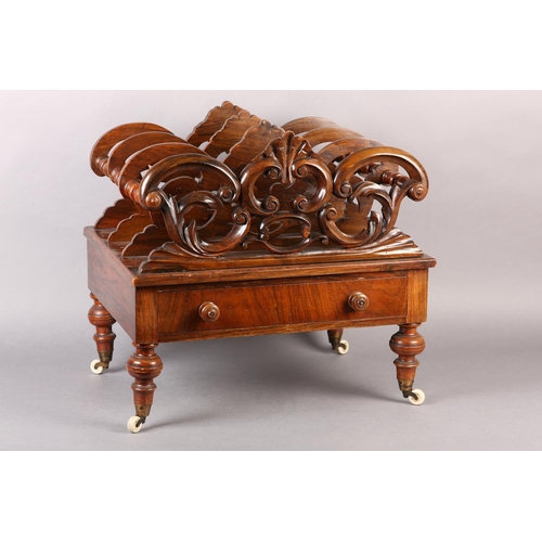 401 - A MID 19TH CENTURY WALNUT CANTERBURY of three divisions, pierced and carved with 'C' scrolls and lea... 