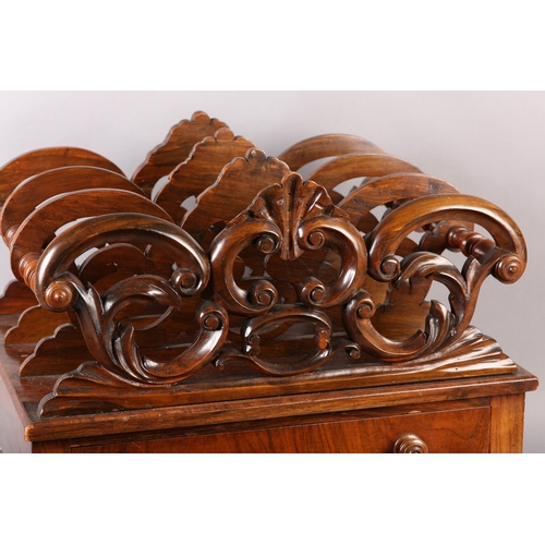 401 - A MID 19TH CENTURY WALNUT CANTERBURY of three divisions, pierced and carved with 'C' scrolls and lea... 