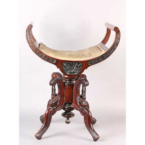 402 - A LATE 19TH CENTURY MAHOGANY REVOLVING PIANO STOOL, the dished seat with open curved upright arms, t... 