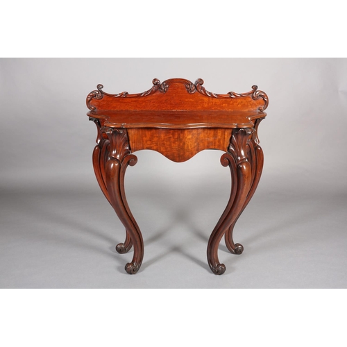 408 - A MID 19TH CENTURY MAHOGANY HALL TABLE of serpentine outline, having a raised back moulded with leaf... 