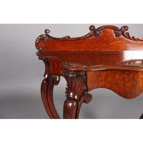 408 - A MID 19TH CENTURY MAHOGANY HALL TABLE of serpentine outline, having a raised back moulded with leaf... 