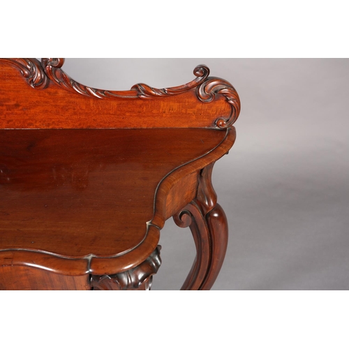 408 - A MID 19TH CENTURY MAHOGANY HALL TABLE of serpentine outline, having a raised back moulded with leaf... 