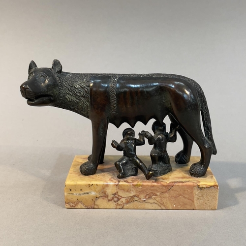 62 - A LATE 19TH CENTURY BRONZE GROUP OF ROMULUS AND SHE-WOLF, on marble plinth, 9.5cm high (Shipping cat... 