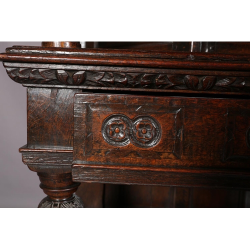 358 - A 17TH CENTURY JOINED OAK COURT CUPBOARD, having a foliate carved cornice, the frieze inlaid in ebon... 