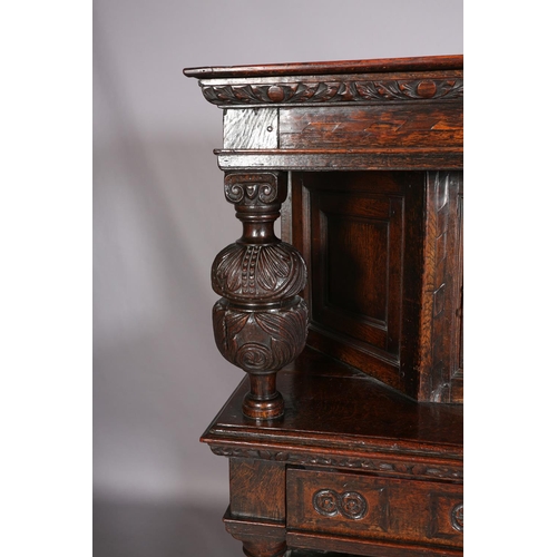 358 - A 17TH CENTURY JOINED OAK COURT CUPBOARD, having a foliate carved cornice, the frieze inlaid in ebon... 