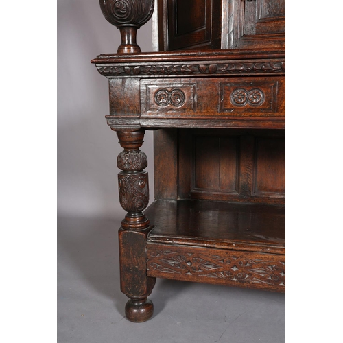 358 - A 17TH CENTURY JOINED OAK COURT CUPBOARD, having a foliate carved cornice, the frieze inlaid in ebon... 