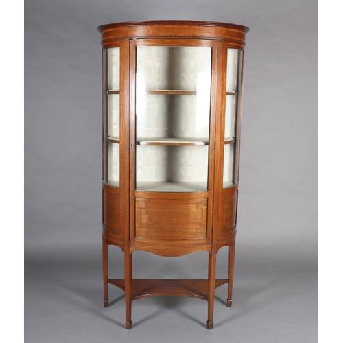 405 - AN EDWARD VII MAHOGANY AND SATINWOOD BOW FRONTED DISPLAY CABINET, crossbanded, having a moulded corn... 