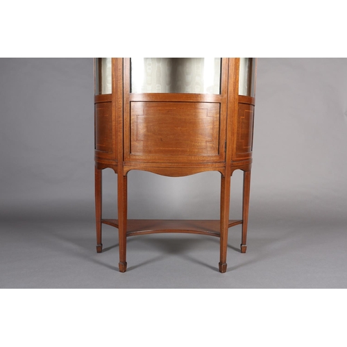 405 - AN EDWARD VII MAHOGANY AND SATINWOOD BOW FRONTED DISPLAY CABINET, crossbanded, having a moulded corn... 