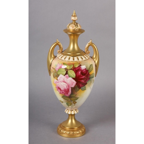 84 - A ROYAL WORCESTER URN-SHAPE VASE AND OVER PAINTED BY W H AUSTIN WITH RED AND PINK ROSES, signed the ... 