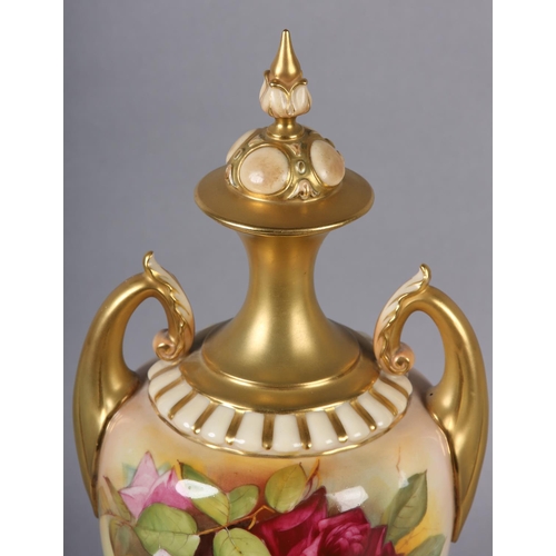 84 - A ROYAL WORCESTER URN-SHAPE VASE AND OVER PAINTED BY W H AUSTIN WITH RED AND PINK ROSES, signed the ... 