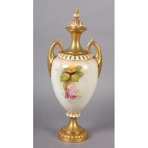 84 - A ROYAL WORCESTER URN-SHAPE VASE AND OVER PAINTED BY W H AUSTIN WITH RED AND PINK ROSES, signed the ... 