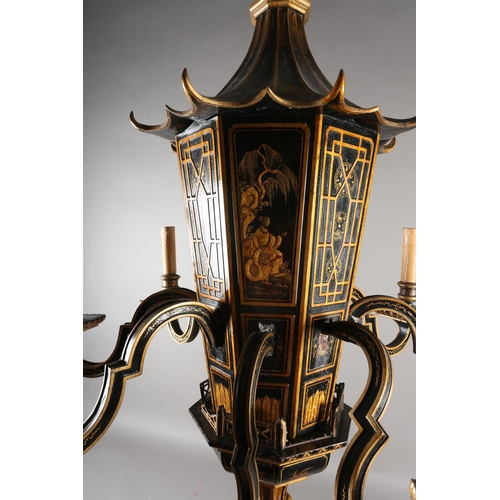 37 - A LACQUERED BLACK AND GILT EIGHT ARM ELECTROLIER, the main stem formed as a pagoda with sloping roof... 