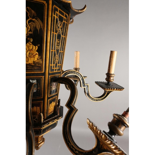 37 - A LACQUERED BLACK AND GILT EIGHT ARM ELECTROLIER, the main stem formed as a pagoda with sloping roof... 