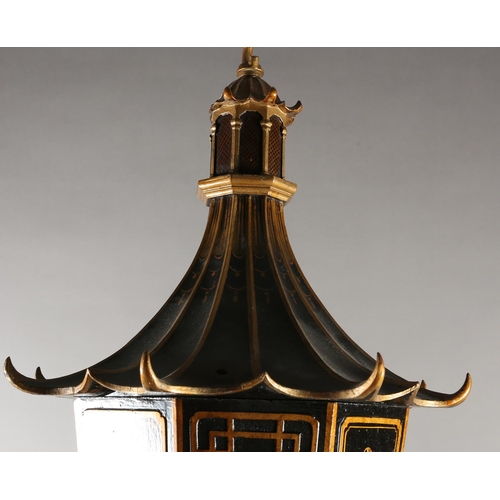 37 - A LACQUERED BLACK AND GILT EIGHT ARM ELECTROLIER, the main stem formed as a pagoda with sloping roof... 