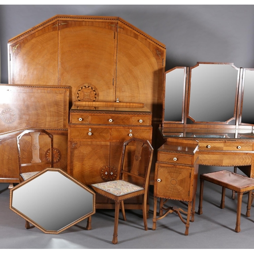 423 - AN ART DECO WALNUT, EBONY AND ROSEWOOD INLAID BEDROOM SUITE of radiating veneers centred with concen... 