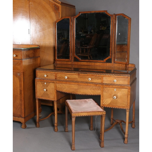 423 - AN ART DECO WALNUT, EBONY AND ROSEWOOD INLAID BEDROOM SUITE of radiating veneers centred with concen... 