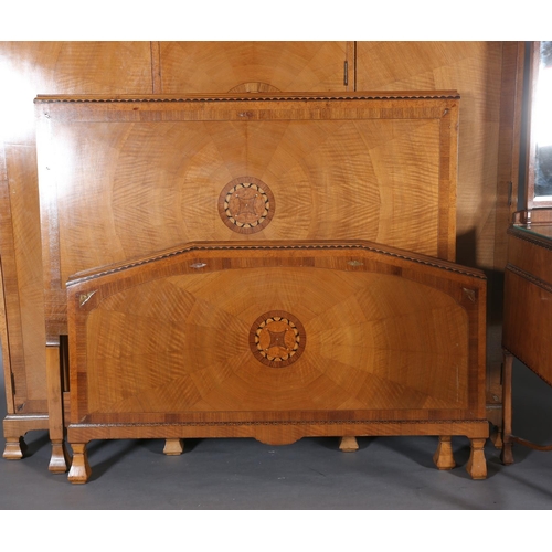 423 - AN ART DECO WALNUT, EBONY AND ROSEWOOD INLAID BEDROOM SUITE of radiating veneers centred with concen... 