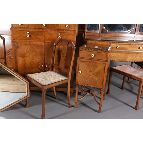 423 - AN ART DECO WALNUT, EBONY AND ROSEWOOD INLAID BEDROOM SUITE of radiating veneers centred with concen... 