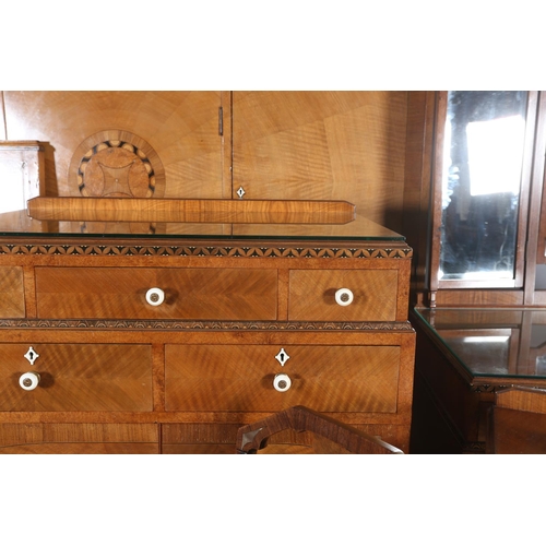 423 - AN ART DECO WALNUT, EBONY AND ROSEWOOD INLAID BEDROOM SUITE of radiating veneers centred with concen... 