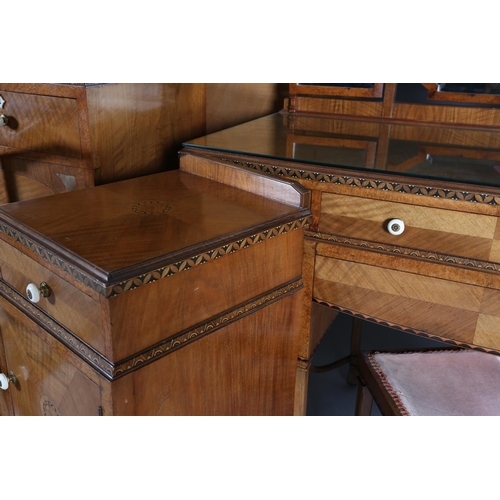 423 - AN ART DECO WALNUT, EBONY AND ROSEWOOD INLAID BEDROOM SUITE of radiating veneers centred with concen... 