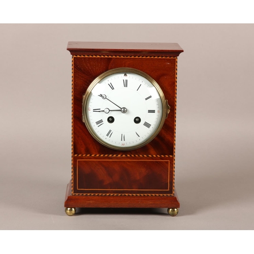 51 - AN EDWARD VII MAHOGANY MANTEL CLOCK INLAID WITH BOXWOOD AND EBONY STRINGING, having a French 8-day m... 