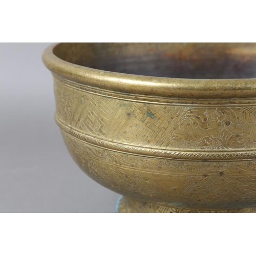 126 - A CHINESE BRASS BOWL, the annulated body engraved with reserves of peony and diaper cell on foot rim... 