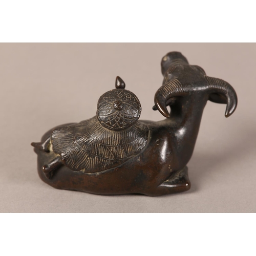 128 - A 19TH CENTURY CHINESE BRONZE GROUP OF A BOY LYING ON THE BACK OF A RECUMBENT WATER BUFFALO, 11cm wi... 