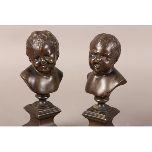 56 - A PAIR OF LATE 19TH CENTURY BRONZE BUSTS OF INFANTS, after Messerschmidt (1736-1783), one laughing, ... 