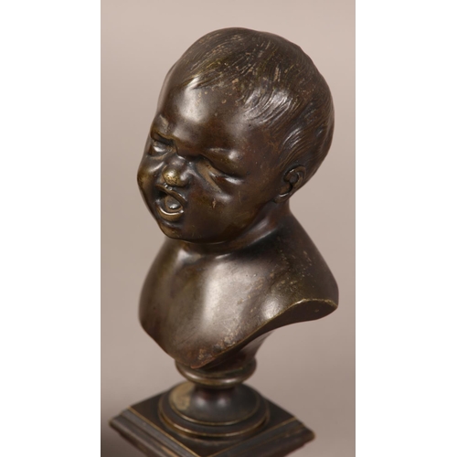 56 - A PAIR OF LATE 19TH CENTURY BRONZE BUSTS OF INFANTS, after Messerschmidt (1736-1783), one laughing, ... 