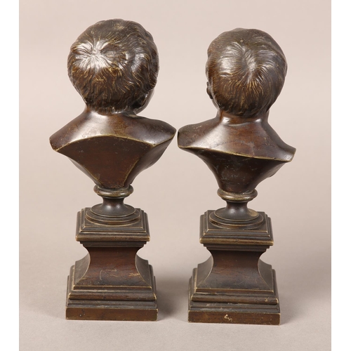 56 - A PAIR OF LATE 19TH CENTURY BRONZE BUSTS OF INFANTS, after Messerschmidt (1736-1783), one laughing, ... 