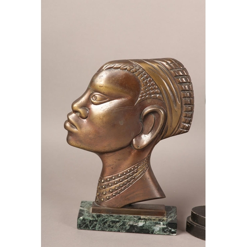 57 - TWO EARLY 20TH CENTURY BRONZE PROFILES OF AN AFRICAN TRIBESMAN AND WOMAN, after Hagenau, coppered pa... 