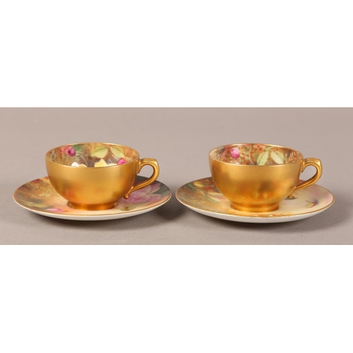 83 - A PAIR OF ROYAL WORCESTER CABINET CUPS AND SAUCERS, painted with yellow and pink roses, signed Twin,... 