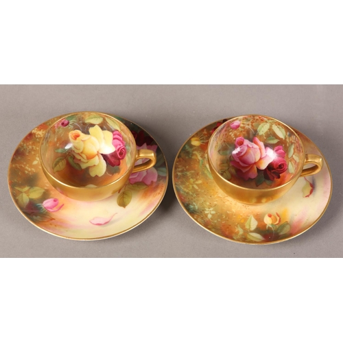 83 - A PAIR OF ROYAL WORCESTER CABINET CUPS AND SAUCERS, painted with yellow and pink roses, signed Twin,... 