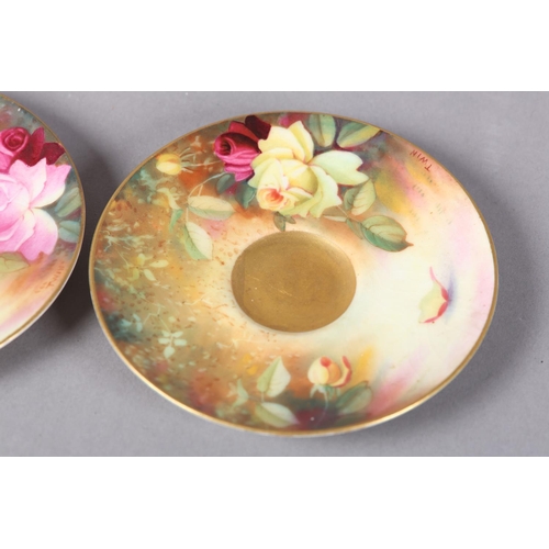 83 - A PAIR OF ROYAL WORCESTER CABINET CUPS AND SAUCERS, painted with yellow and pink roses, signed Twin,... 