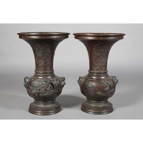 107 - A PAIR OF JAPANESE BRONZE VASES, MEIJI PERIOD, of baluster outline, the neck cast with opposing pane... 