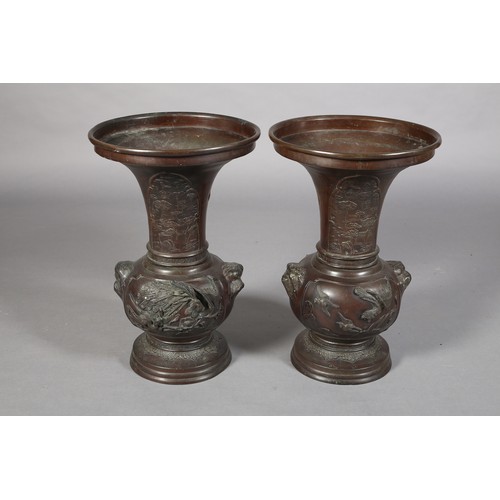 107 - A PAIR OF JAPANESE BRONZE VASES, MEIJI PERIOD, of baluster outline, the neck cast with opposing pane... 