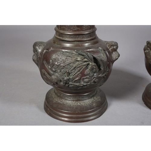 107 - A PAIR OF JAPANESE BRONZE VASES, MEIJI PERIOD, of baluster outline, the neck cast with opposing pane... 