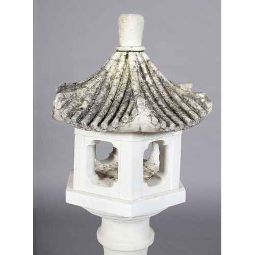 108 - A WHITE MARBLE GARDEN JAPANESE LANTERN with carved titled pagoda hood, the hexagonal body with quatr... 