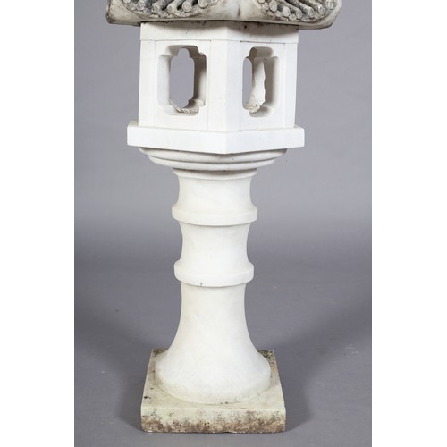 108 - A WHITE MARBLE GARDEN JAPANESE LANTERN with carved titled pagoda hood, the hexagonal body with quatr... 